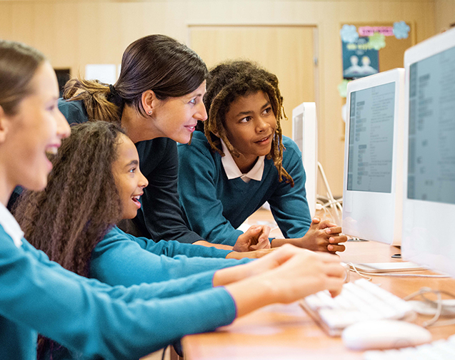 School kids looking at a computer screen